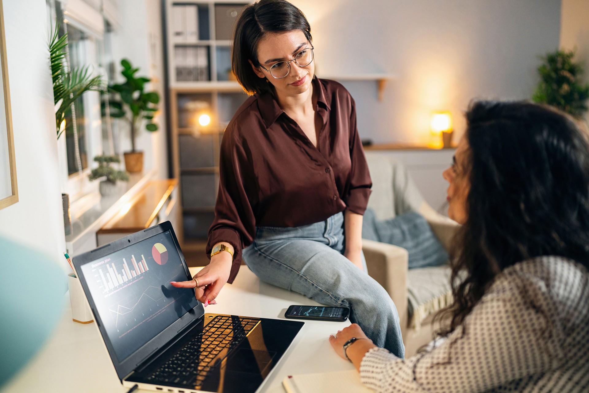 Female financial advisor, teaching and explaining to her client new ways of investing